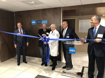 Andreas Dracopoulos, co-president of the Stavros Niarchos Foundation, and other representatives cut a ribbon at the Stavros Niarchos Foundation Complex Joint Reconstruction Center